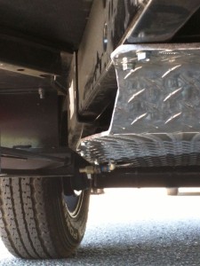 Front skid plate, from passenger side, note the cutout for water drain near the back