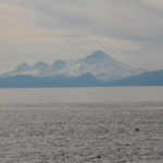 While I can't be certain I believe this is Iliamna Volcano, across Cook Inlet