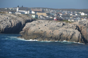 Channel-Port aux Basques stretching out behind the rocky shore